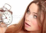 511708_stock-photo-unhappy-girl-waking-up-too-late-and-looking-at-the-alarm-clock